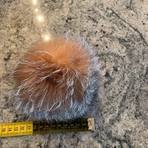 Real fur PomPom can be attached on a hat or anything else